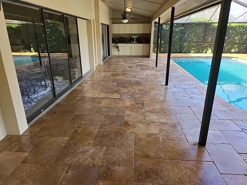 Travertine pool deck cleaned and sealed in Plant City